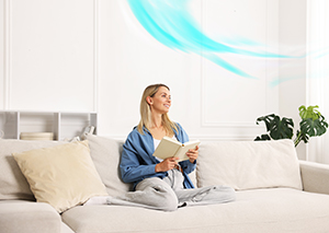 Homeowner enjoying clean indoor air quality thanks to HVAC repair in Manasquan